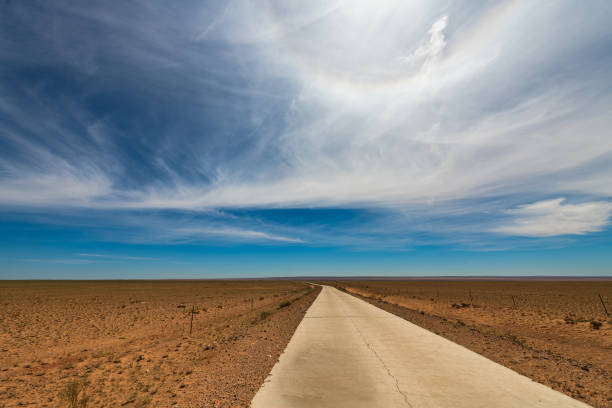 istock Grassland and rural roads under blue sky and white clouds, Inner Mongolia, China 2188520261