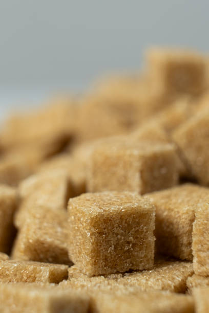 Macro cubes of brown cane unrefined demerara sugar