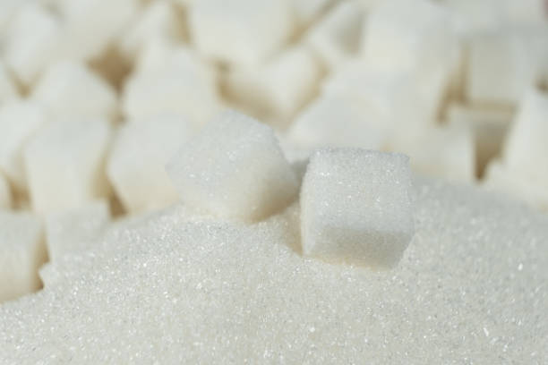 istock White refined beet sugar in the form of crystals and cubes. 2188520643