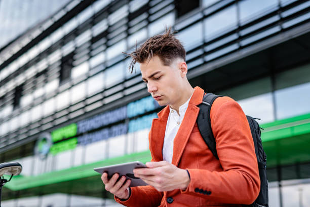 istock Businessman surfing the net on digital tablet 2188521062