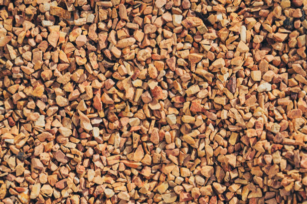 Gravel texture background with small, irregular stones earthy tones. This natural material is often used landscaping, construction, and decorative purposes, adding rustic touch to various projects