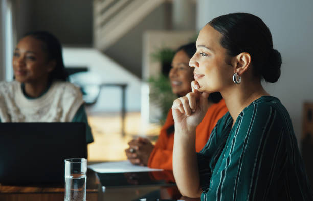 istock Group of Women Watching a Presentation at Boardroom Table 2188521530