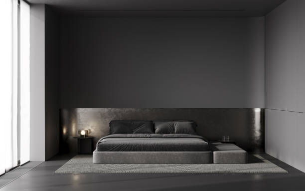 istock Stylish dark bedroom interior with modern bed, metal panel and black empty wall 2188523548