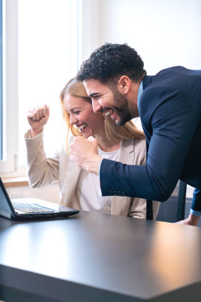istock Excited Business Team Celebrating Success in Office.Vertical 2188526196