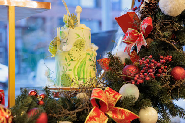 Decorated Christmas tree, real Nordmann fir in front of blurred window.