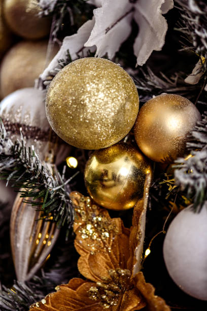 istock Gold Christmas Lanterns Hanging From Christmas Tree Branches 2188529564