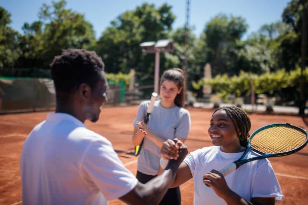 istock Proud coach with tennis players 2188530572