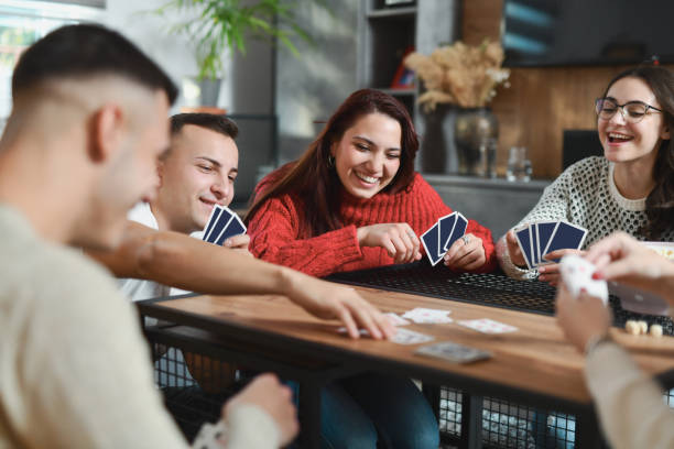 istock Smiling Friends Waiting to See Who Will Win This Card Game Round 2188533920