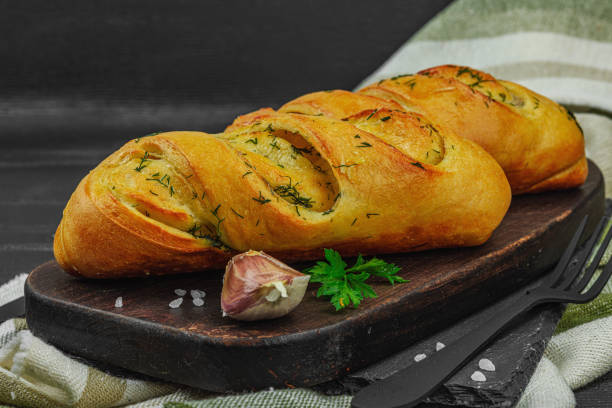Fresh baked garlic bread, gluten free buns. Tasty food, fresh parsley, fragrant spices