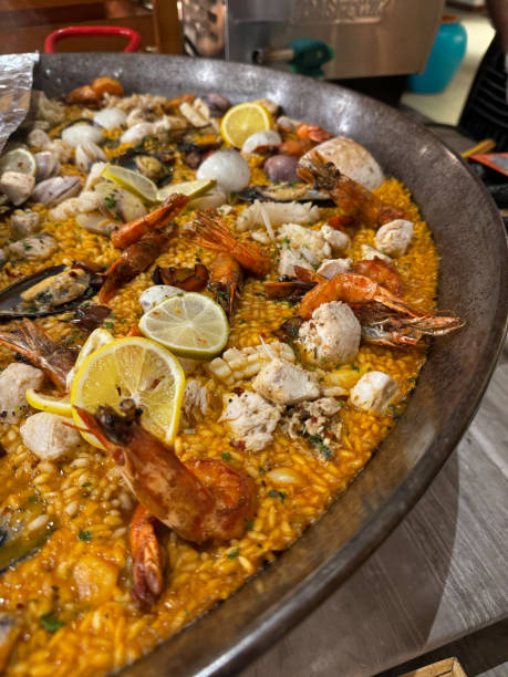 istock Seafood paella stew with prawns, shellfish and mussles served in large Spanish paella pan 2188536896
