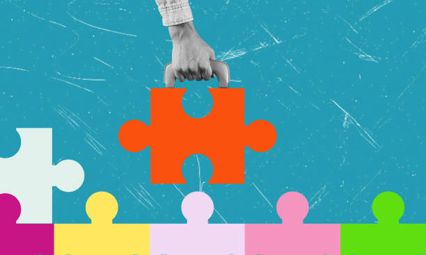 istock Creative puzzle piece being placed into a vibrant colorful landscape during a collaborative project 2188538729