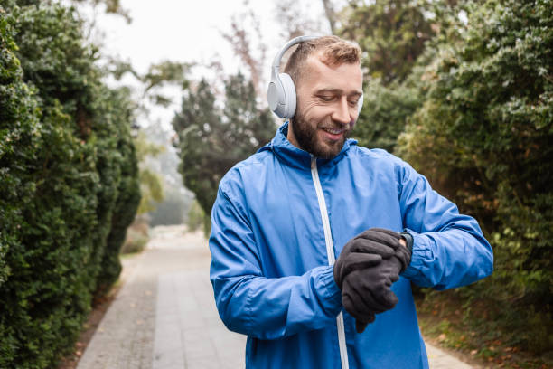 istock Runner with Headphones Relaxing Looking at Smart Watch 2188539946