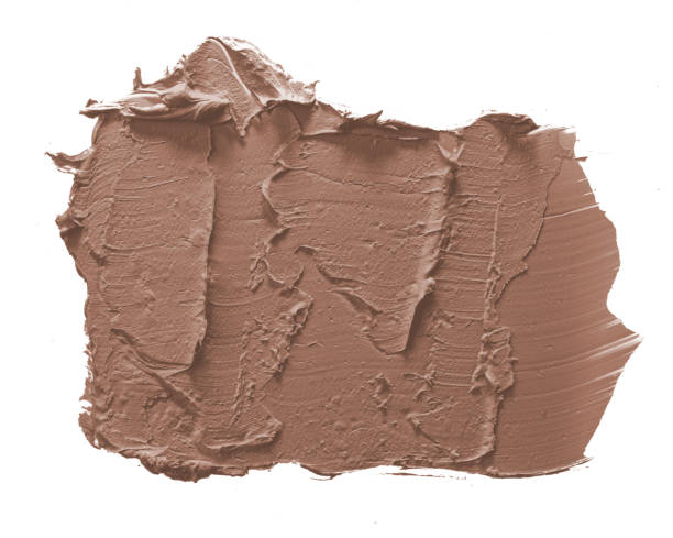 istock Brown cream textured paint smeared on white background showing artistic variation and depth 2188539987
