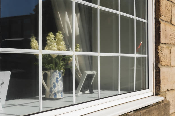 istock Farmhouse Rustic sash windows and decor inside, view from outside 2188540217