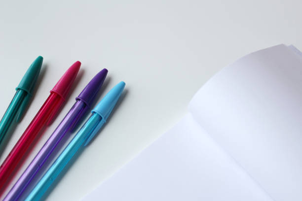 istock Four cool colors ink pen and blank paper notepad with copy space for education banner. 2188547488