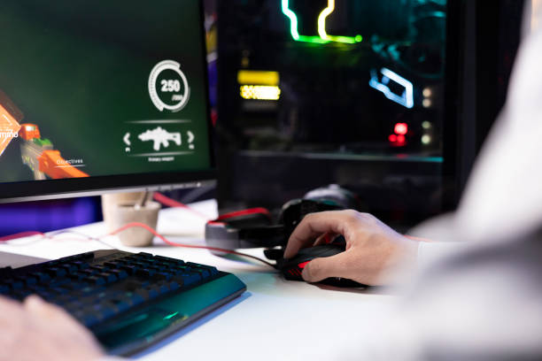 istock Man using gaming mouse to enjoying coop FPS videogame 2188550510