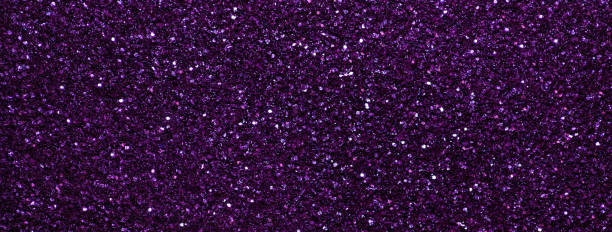 istock Dark violet sparkling background from small sequins, macro. Purple shiny backdrop with glitter pattern. 2188556546