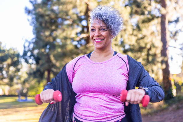 istock Senior Black Woman Stretching and Exercising with Weights 2188558390