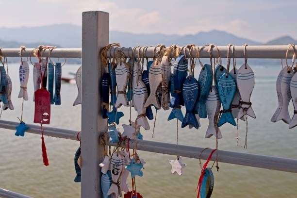 istock Colorful Fish Ornaments by the Water 2188559654