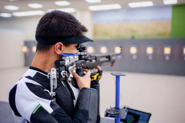 istock Precision Shooting Athlete at an Indoor Range 2188562382
