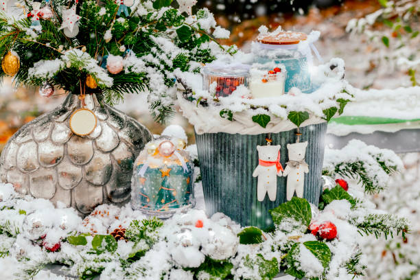 Soft light Christmas background, close-up of soft toy angel with wings on Christmas tree on light bokeh background. Copy space. Greeting card, happy new year and merry Christmas.