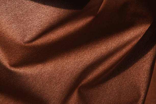 istock Brown silk curtains in the house near window 2188568276