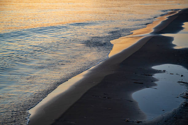 istock Surface of water, wave and puddle on beach. 2188570589