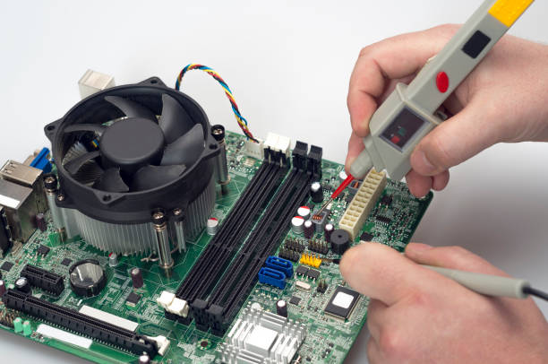 istock engineer repair motherboard for computer.Laptop service repair 2188576078