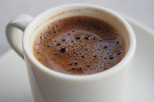 a cup of turkish coffee on table .