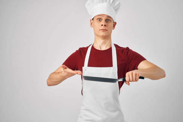 a man in a chef's uniform cooking work professionals