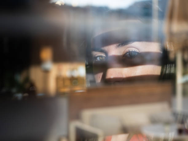 istock A captivating gaze through window blinds in artistic soft-focus 2188579111
