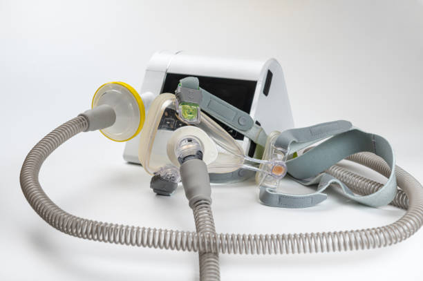 istock Continuous positive airway pressure system includes of CPAP machine, mask, tube on white background 2188580485