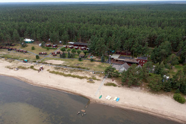 istock This location features a serene seaside resort surrounded by towering trees. 2188580647