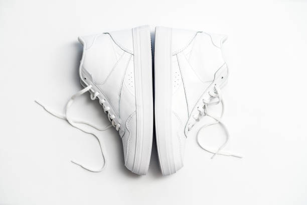 istock Minimalist White High-Top Sneakers on a Simple White Background 2188581043