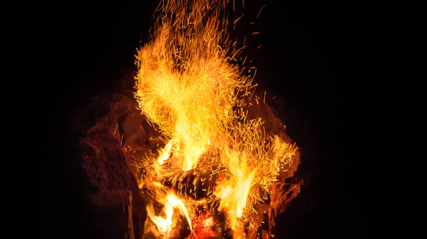 istock Up Close To A Campfire With Sparks At night 2188584479