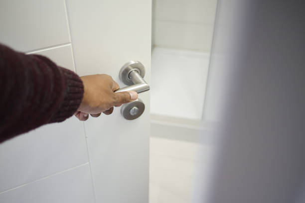 istock Man's Hand Opening door close up 2188585853