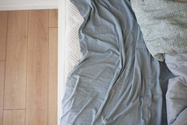 istock messy bed in early morning , messy bed after waking up 2188586729