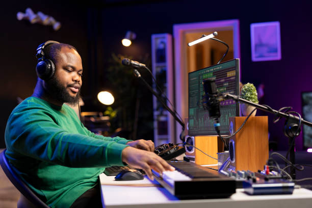 istock Audio designer enhancing sound quality on his audio files with mixing console 2188591922