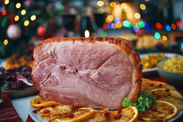 istock Christmas Dinner with Baked Glazed Ham and Various Vegetables 2188592821