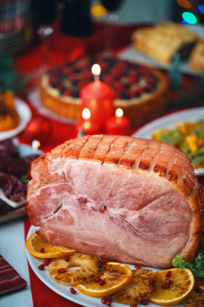 istock Christmas Dinner with Baked Glazed Ham and Various Vegetables 2188592822