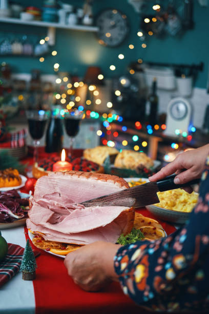 istock Christmas Dinner with Baked Glazed Ham and Various Vegetables 2188592843