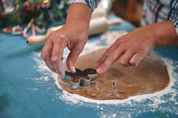 istock Preparing Gingerbread Christmas Cookies with Icing 2188592870
