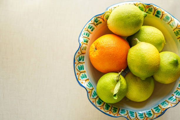 Hand-painted fruit serving bowl from Sicily, Italy with orange and lemon, top view