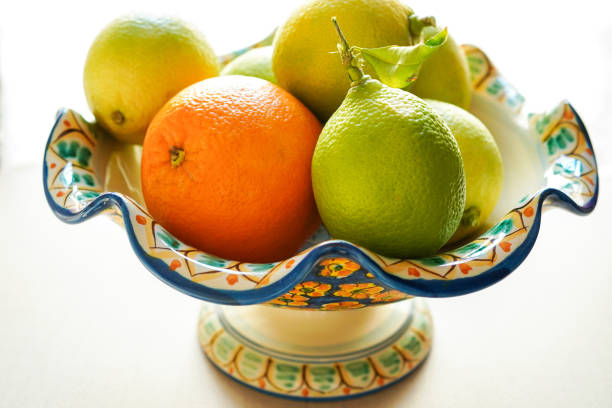 Citrus fruits cut arrangement oranges tangerines lime lemon and grapefruit with leaves isolated on white background leaving copy space