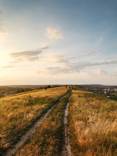istock Dirt road on top of the hill range. 2188594568