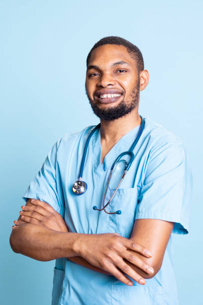 istock Portrait of friendly professional nurse standing with arms folded, 2188596967