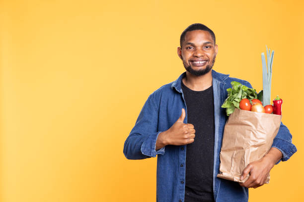 istock Positive enthusiastic person shows thumbs up sign in studio 2188602972