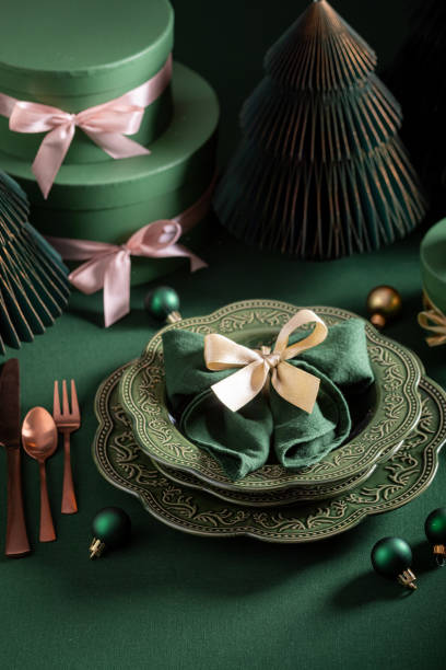istock Beautiful bottle green Christmas tableware with presents and tableware. 2188604001