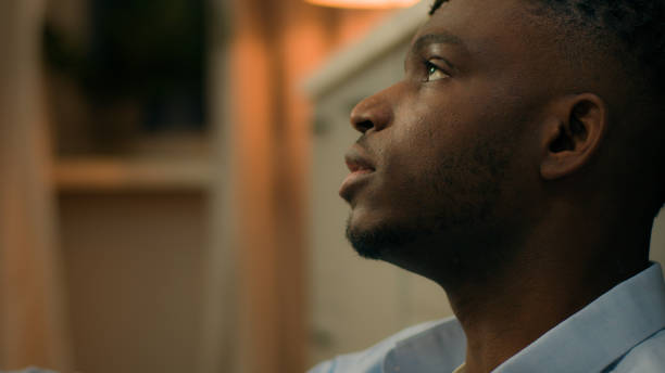 istock Addicted upset drunk African American depressed stress man sad suffer problem ethnic guy male addiction stressed mental worry bad habit home kitchen dailure lost health trouble problem suffering alone 2188605340