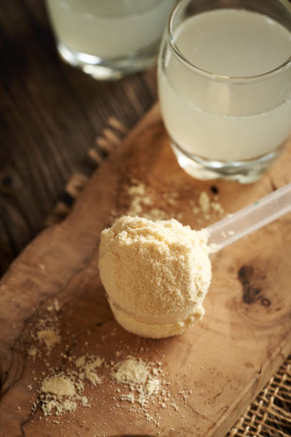 istock Whey protein powder in a scoop with fresh natural whey on a table 2188608252